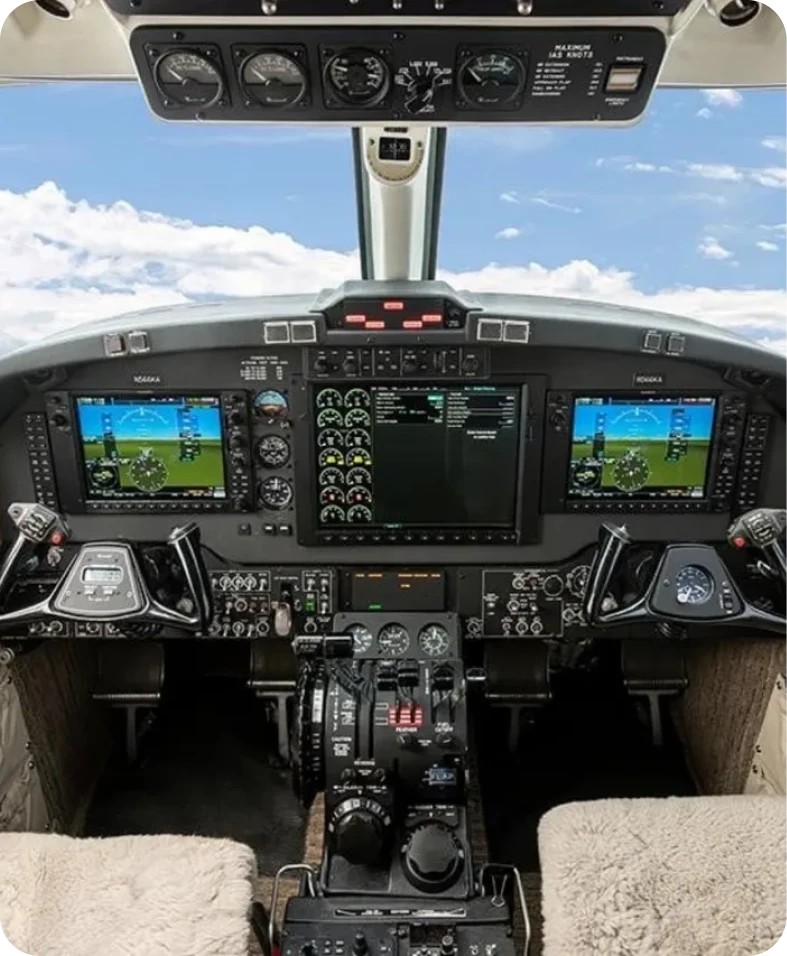 Aircraft cockpit with digital flight displays.