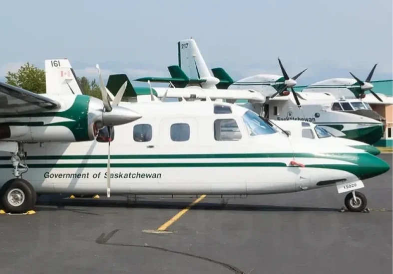 Small green and white government aircraft